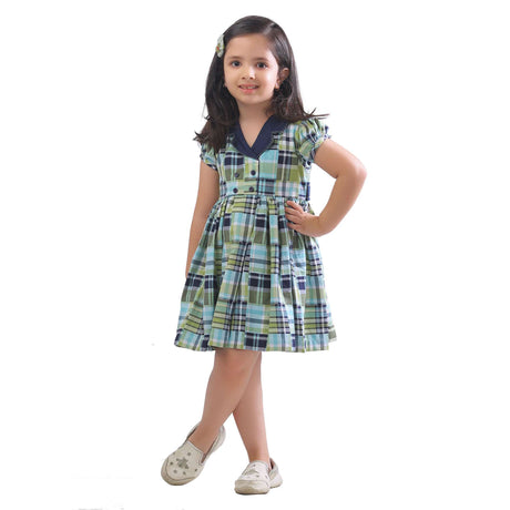 Little girl in plaid dress with faux-lapel closure, puff sleeves and side tabs with buttons and hand embroidered Kantha work on collar