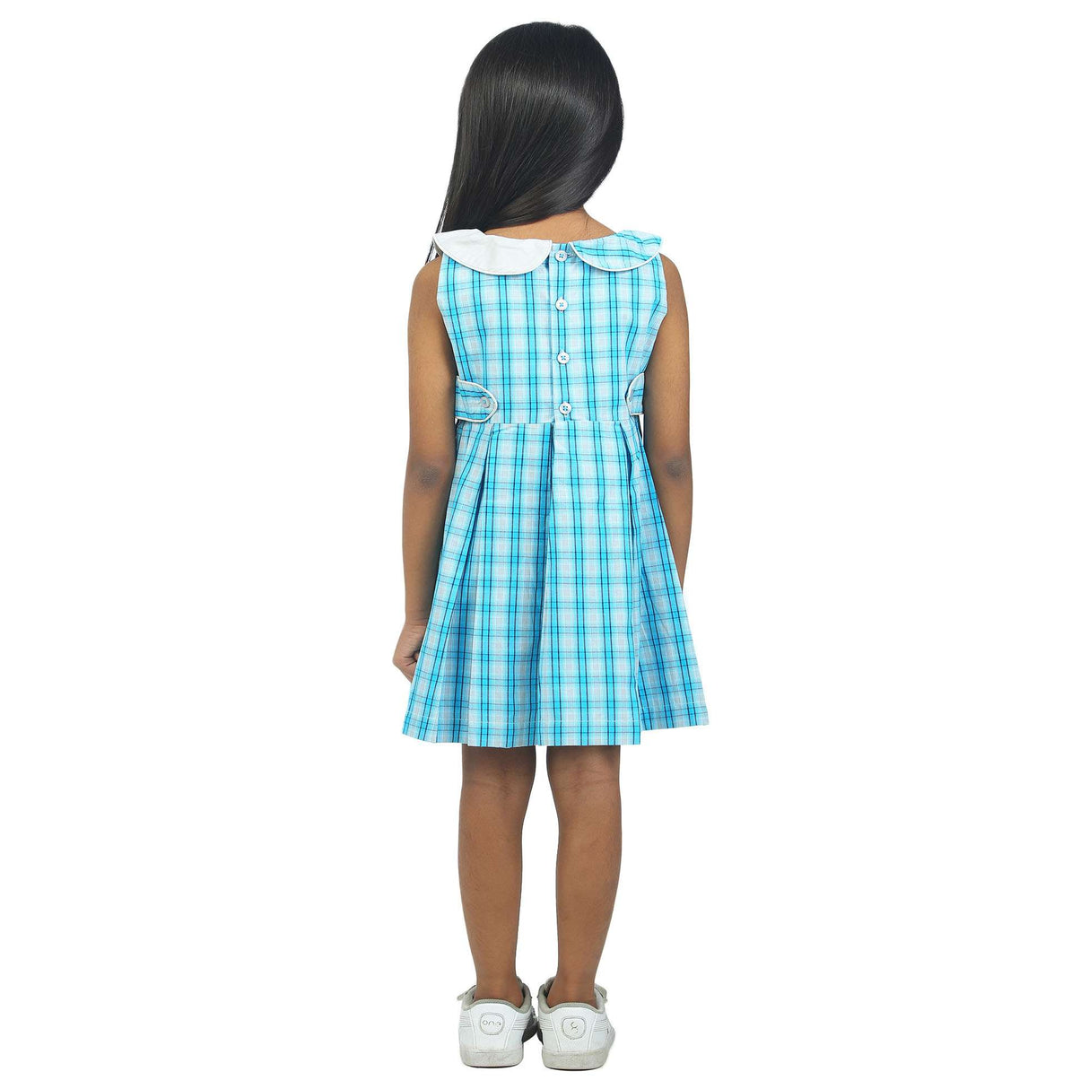 teal plaid fit and flare dress with back tie and collar modelled by a young girl