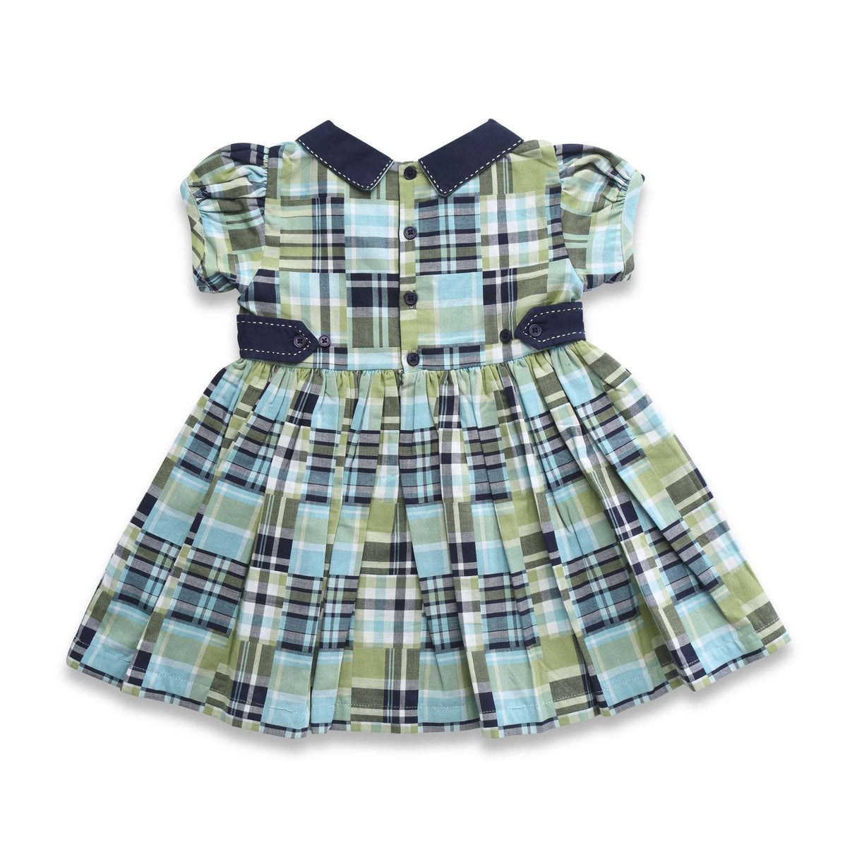 bBack of a girls dress - two back waist tabs in navy and navy collar over a patchwork fabric in green and navy
