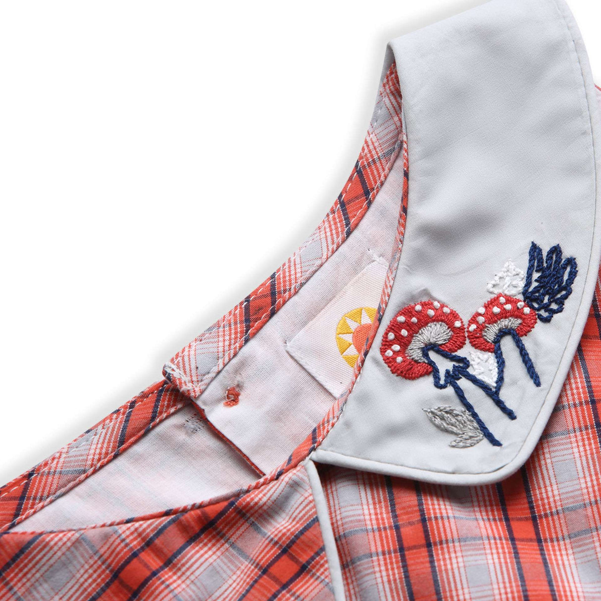 Toadstool embroidery on a girls collar