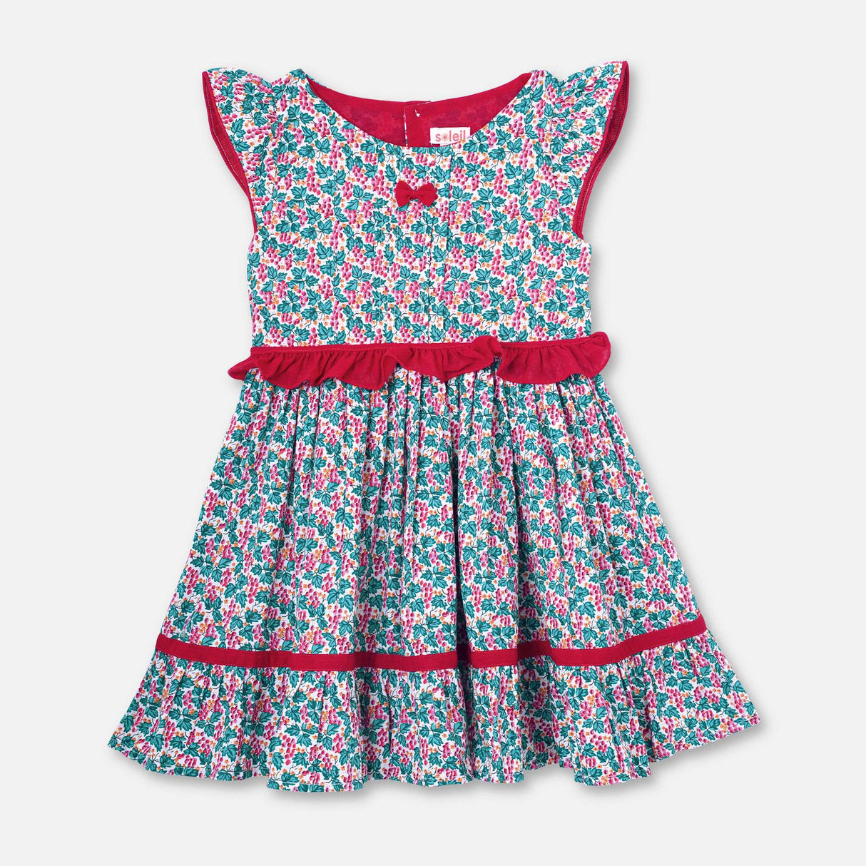 Flatlay of red and green floral printed cotton dress with a tie up fabric ruffle belt