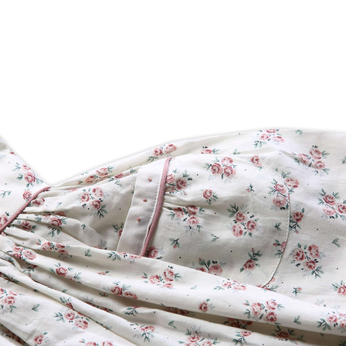 Close-up of the pocket in fall floral printed dress with a contrast dusty pink cord piping