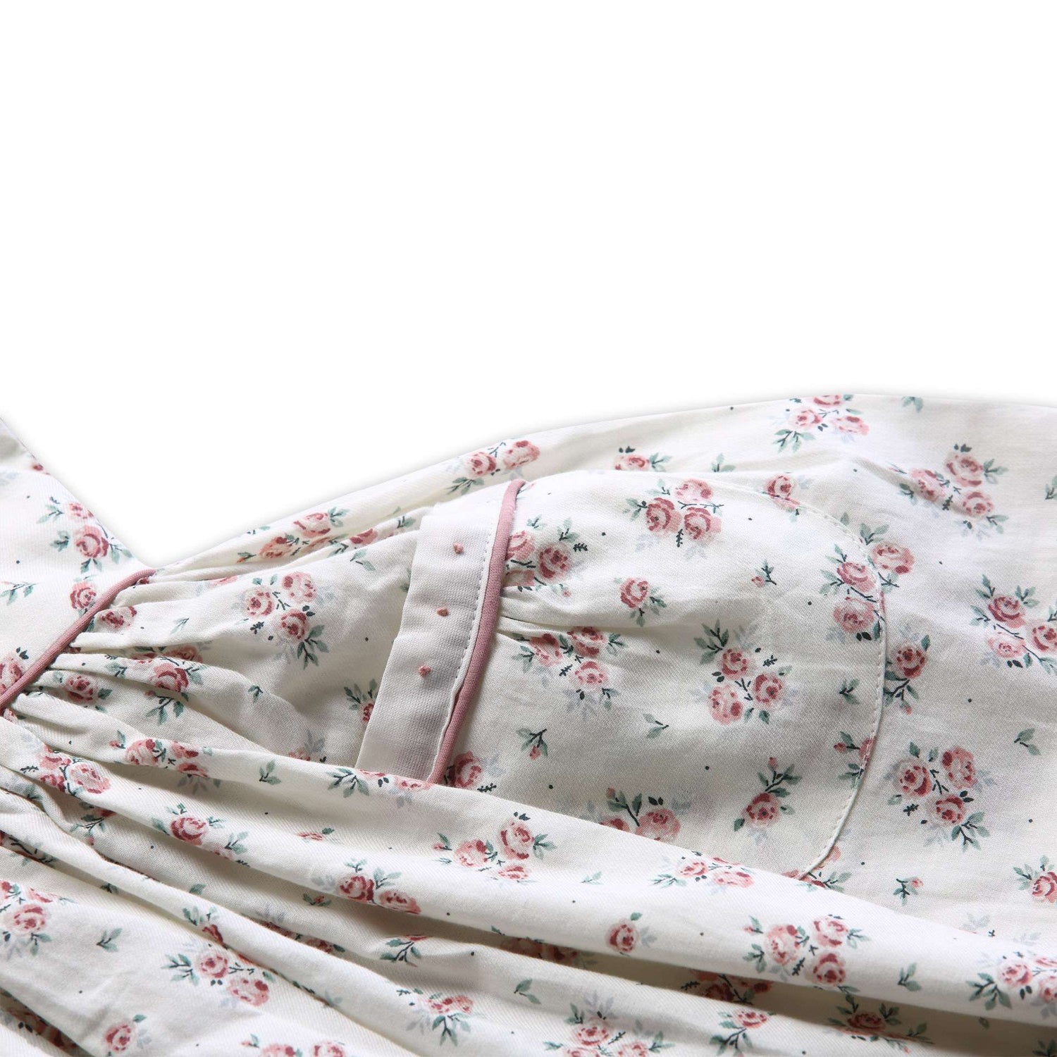 Close-up of the pocket in fall floral printed dress with a contrast dusty pink cord piping