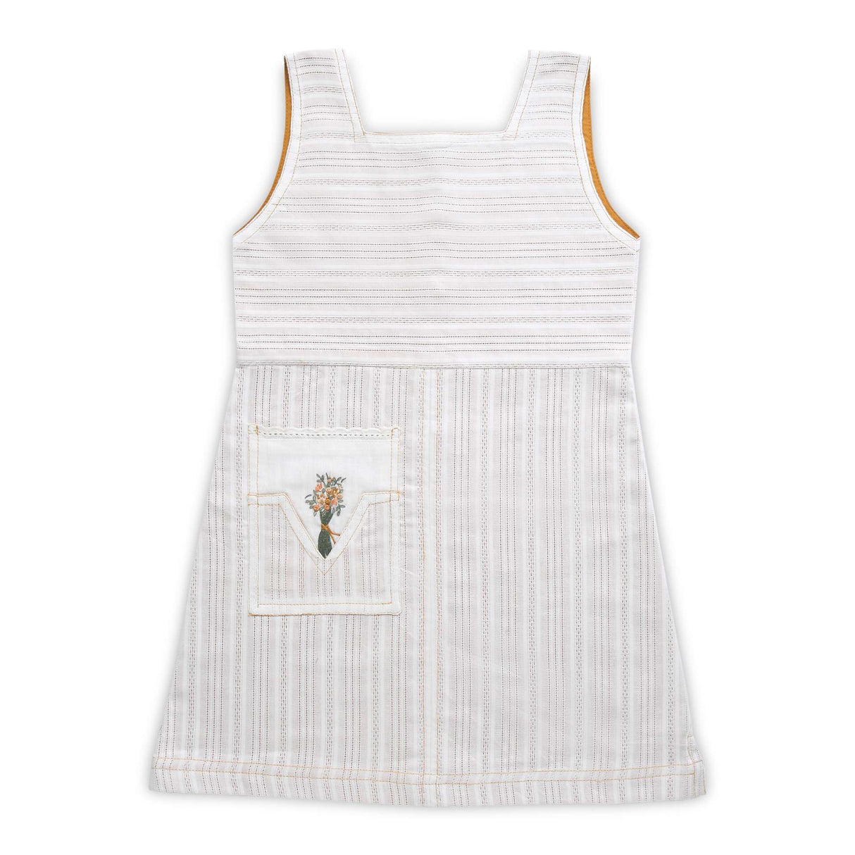 Flatlay of cream dress with mustard lining and side pocket with lace trims embellished with embroidered bouquet