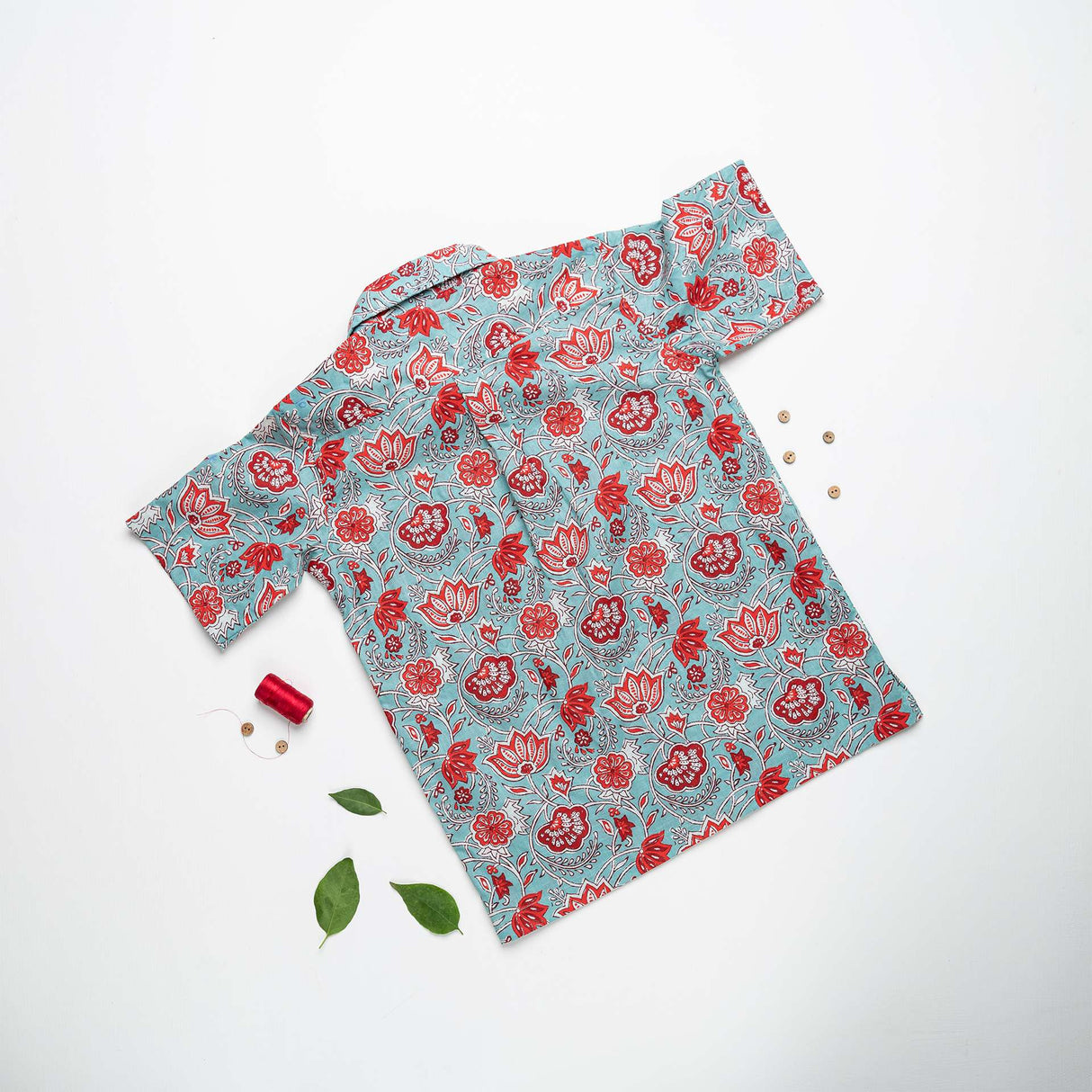 Rear image of teal and coral Indian print shirt with wood buttons