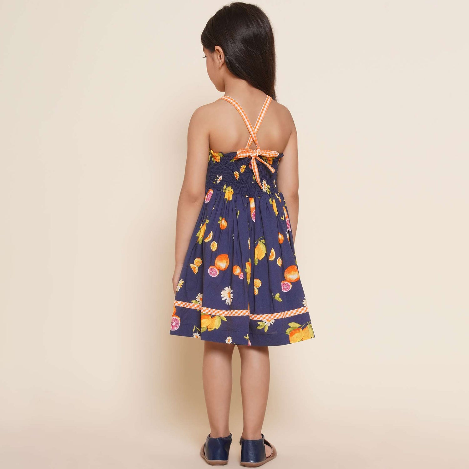 Size chart of strappy shoulder floral and fruit printed navy dress with contrast trims