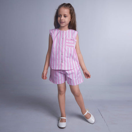 Young girl in pink and white striped co-ords sets