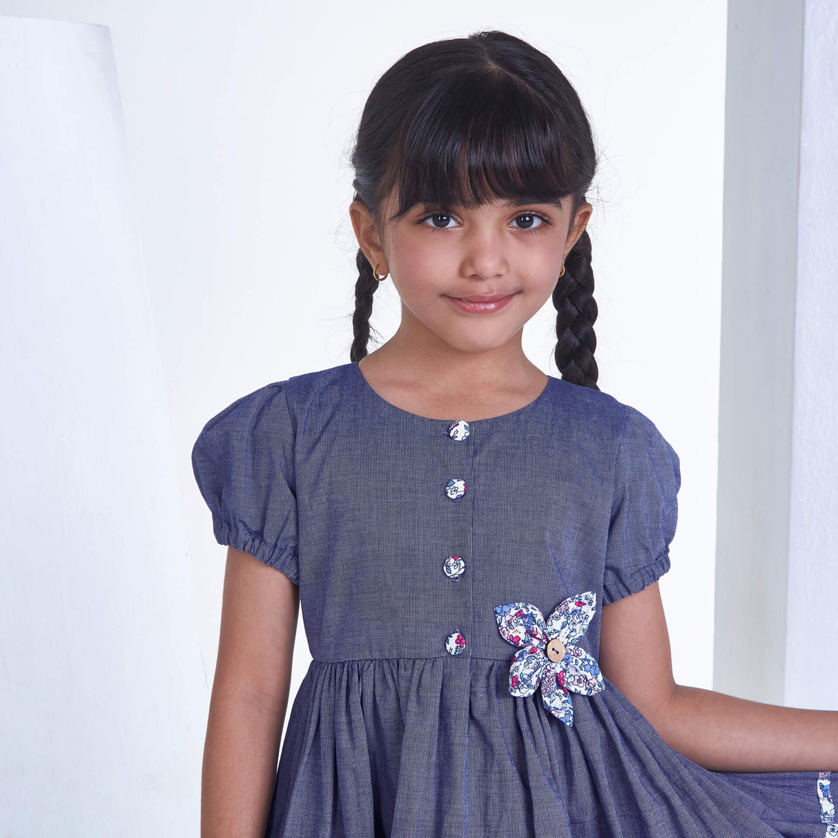 Closeup of a girl in navy flower applique dress