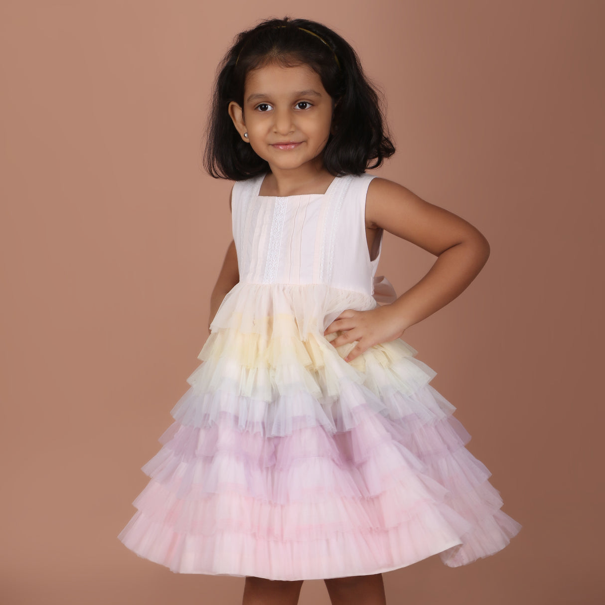 Side angle view of pastel rainbow tulle dress for girls