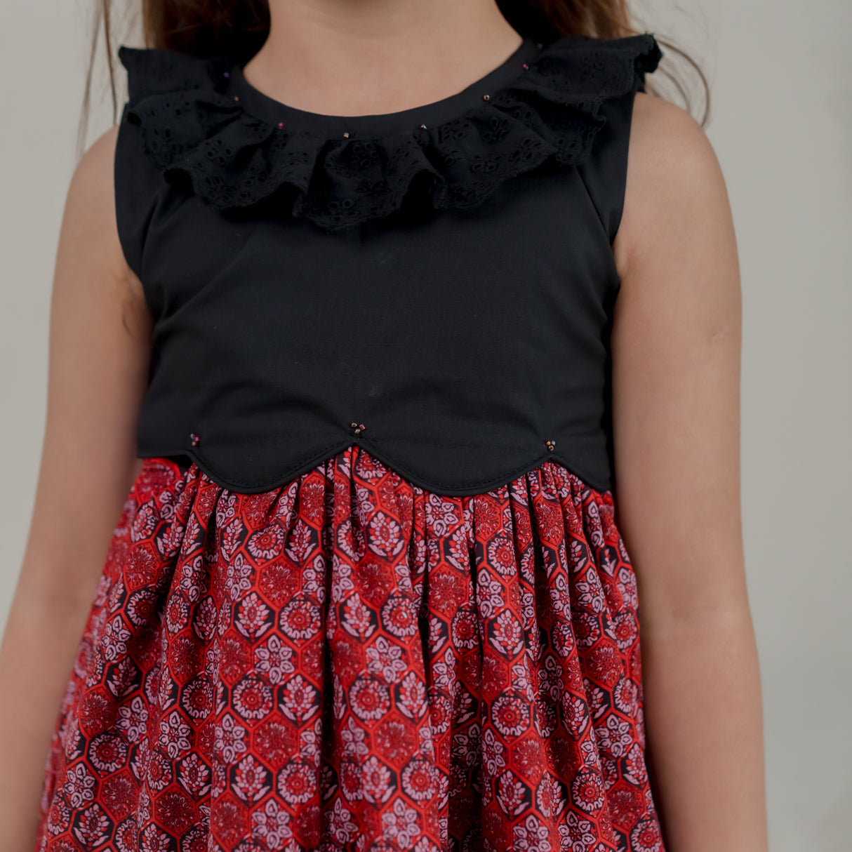 closeup of the black scallop bodice and beads