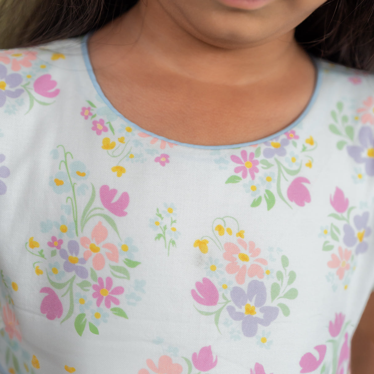 front view showing scallop waistline and schiffli skirt