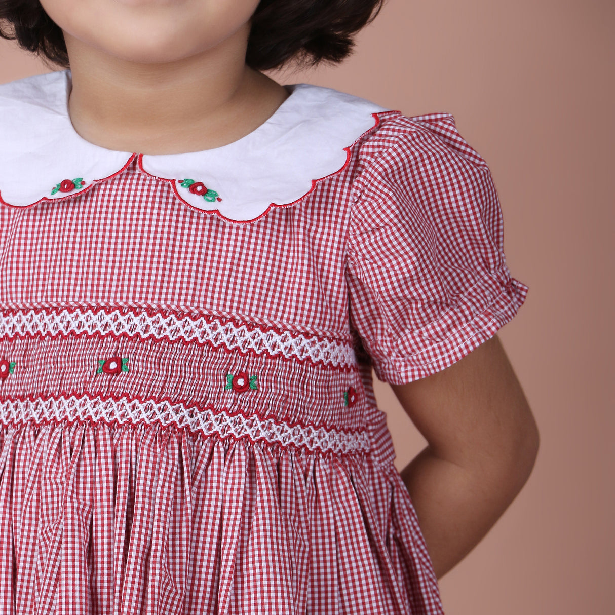 close-up of scalloped collar with embroidery