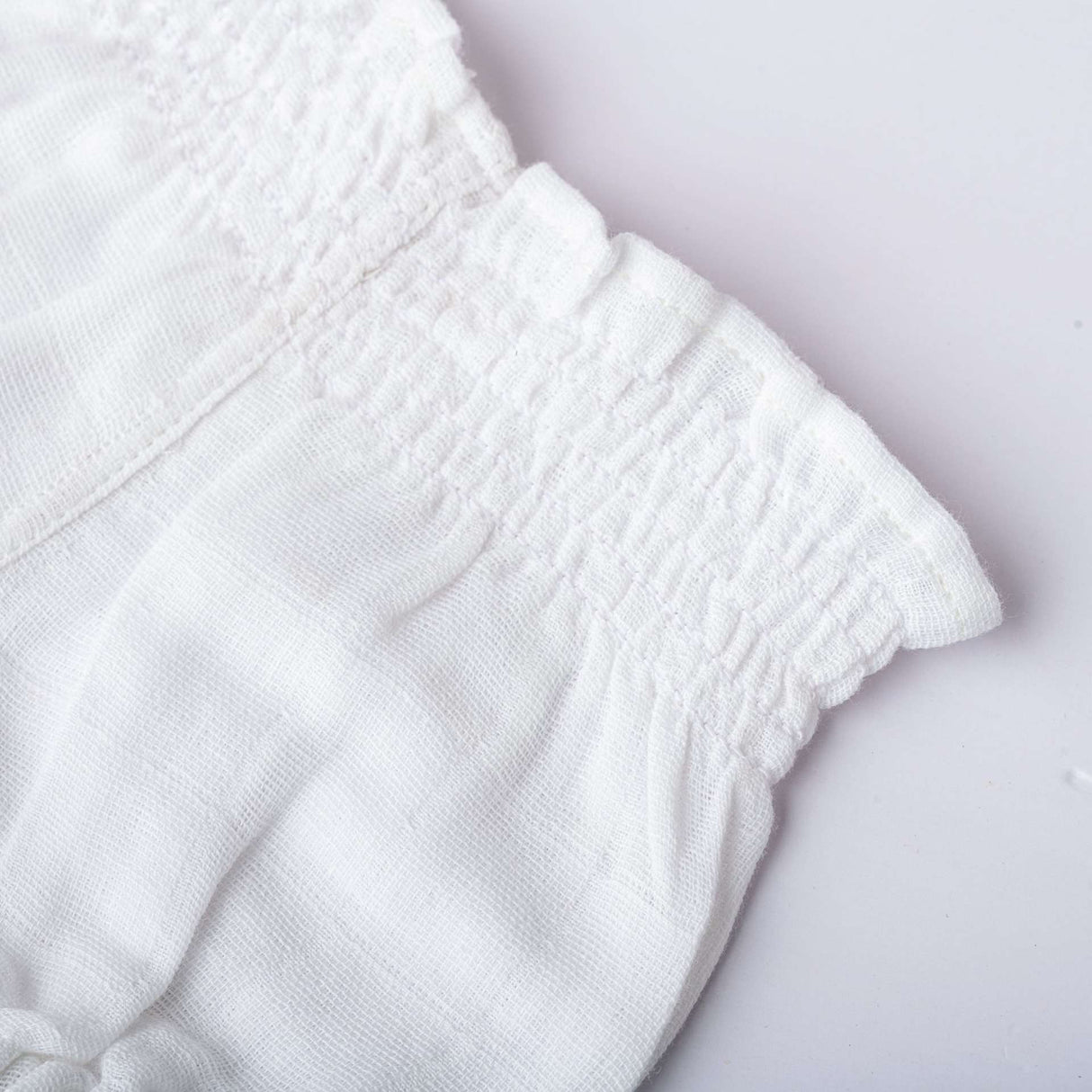 Shirred infant unisex diaper cover bloomers for baby in white gauze muslin