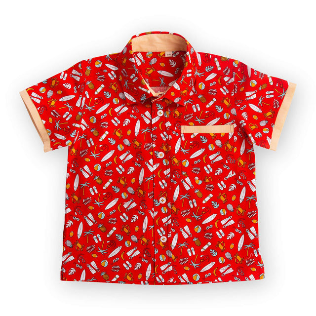 Flatlay of red printed shirt with coordinated fabric bands stitched underneath the pocket and sleeve hems