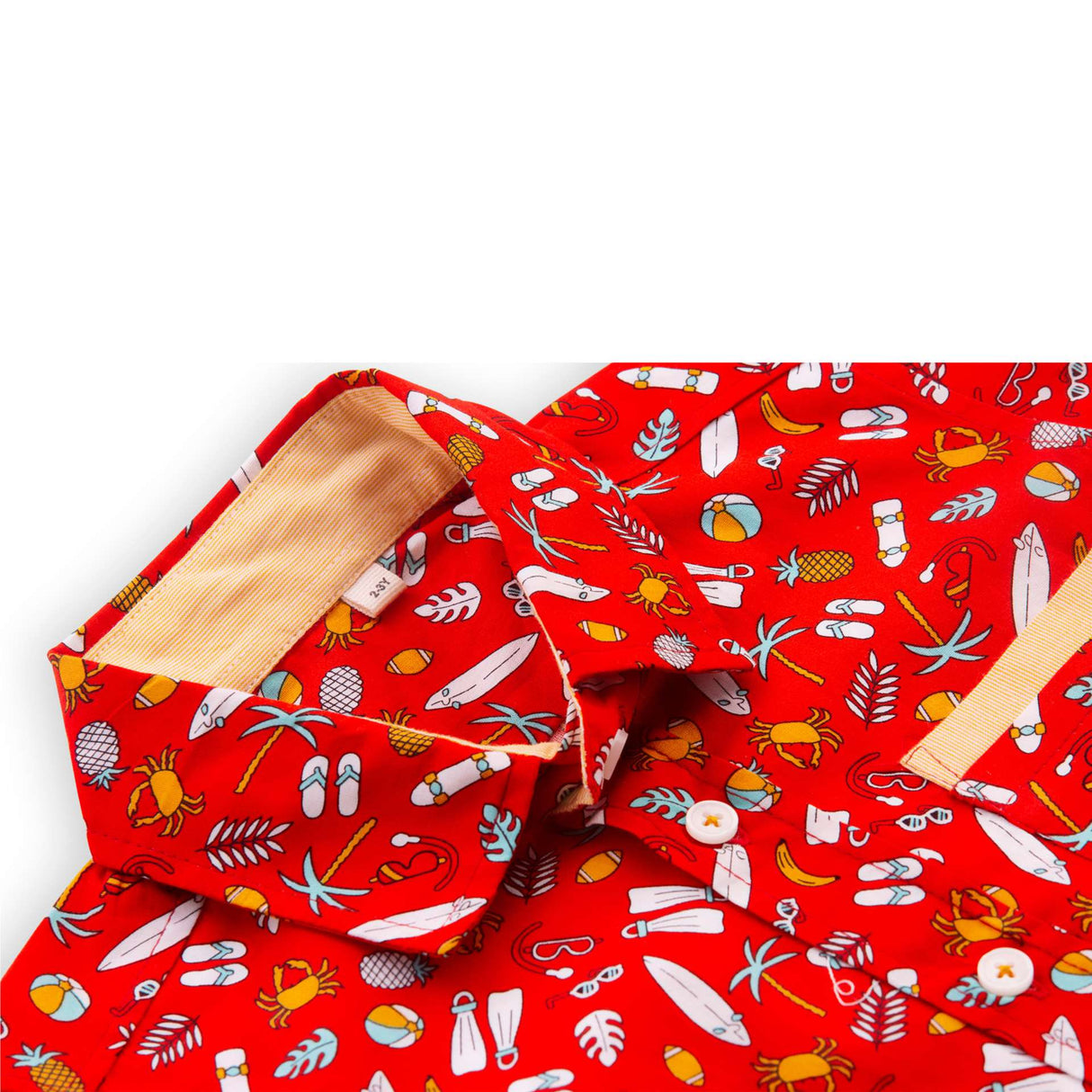 Close-up of red printed shirt with coordinated fabric bands stitched underneath the pocket and sleeve hems