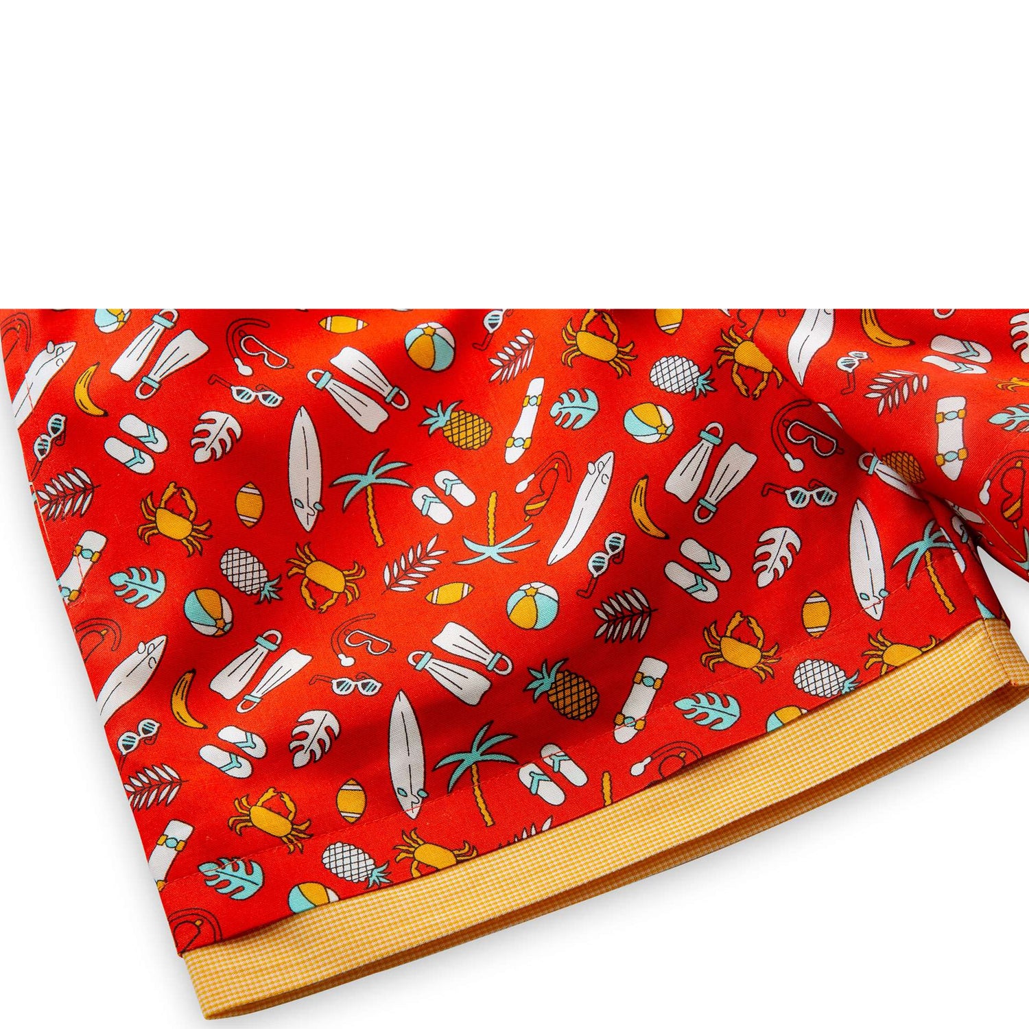 Close-up of red shorts with faux drawstring and contrast side pockets with contrast bands on the hem