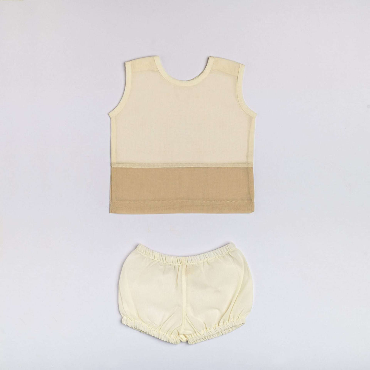 Sleeveless unisex infant jabla in ivory and tan with matched diaper cover