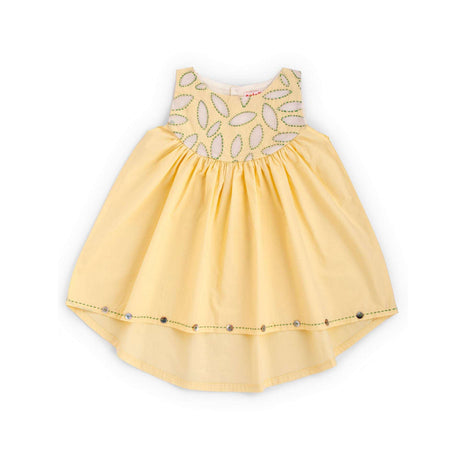 Flatlay of yellow applique cotton dress with a hi lo hem with hand embroidered kantha edging and shell button detail