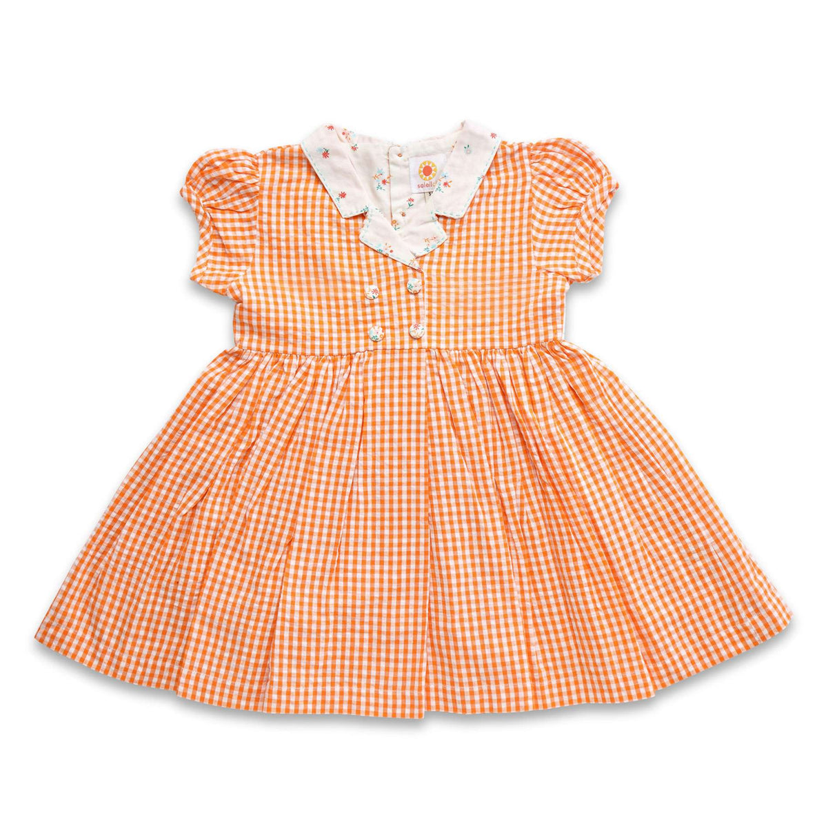 Flatlay of orange gingham dress with faux lapel, double breasted button details and puff sleeves with hand embroidery on the lapel