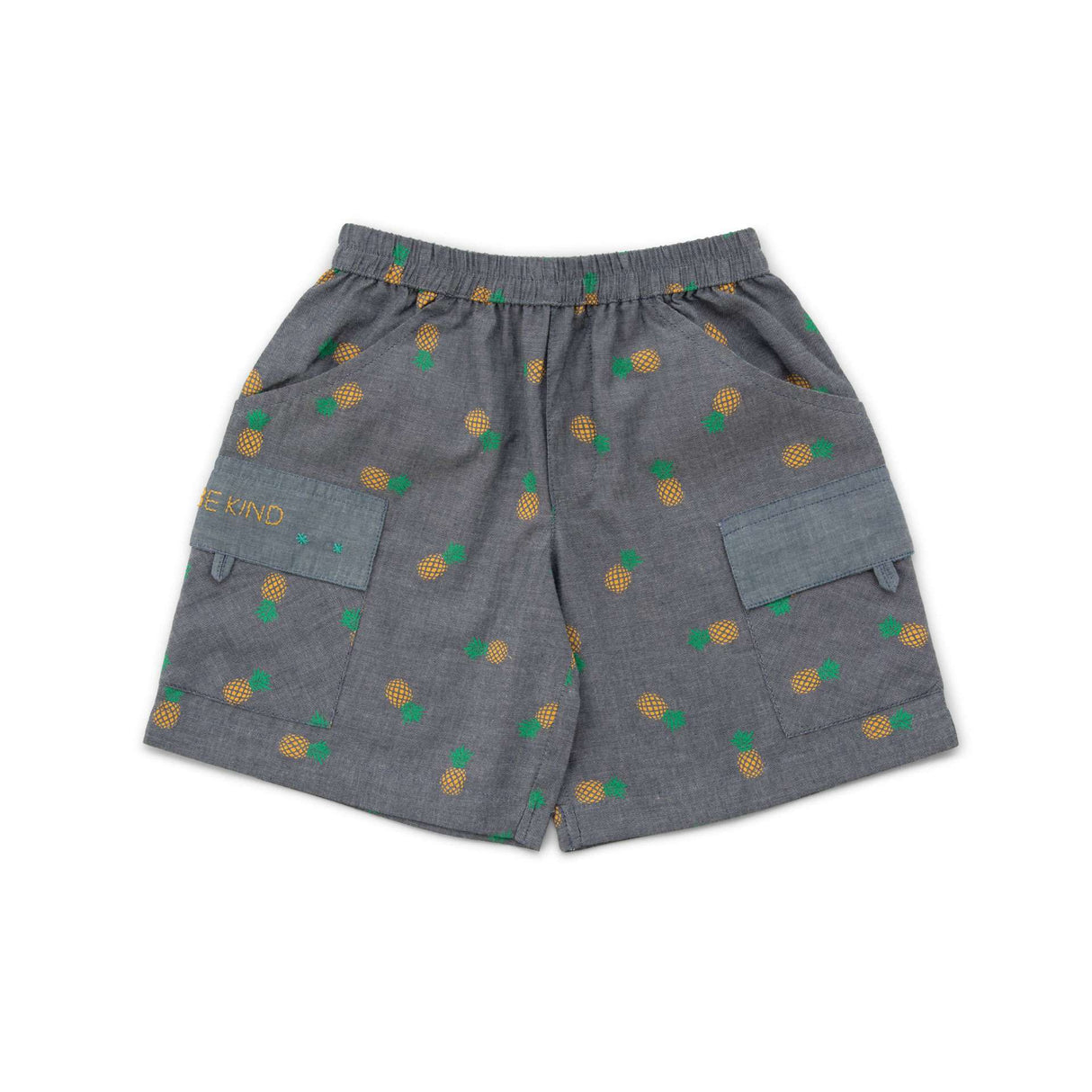 Flatlay of grey shorts with pineapple print and pockets with hand embroidered message