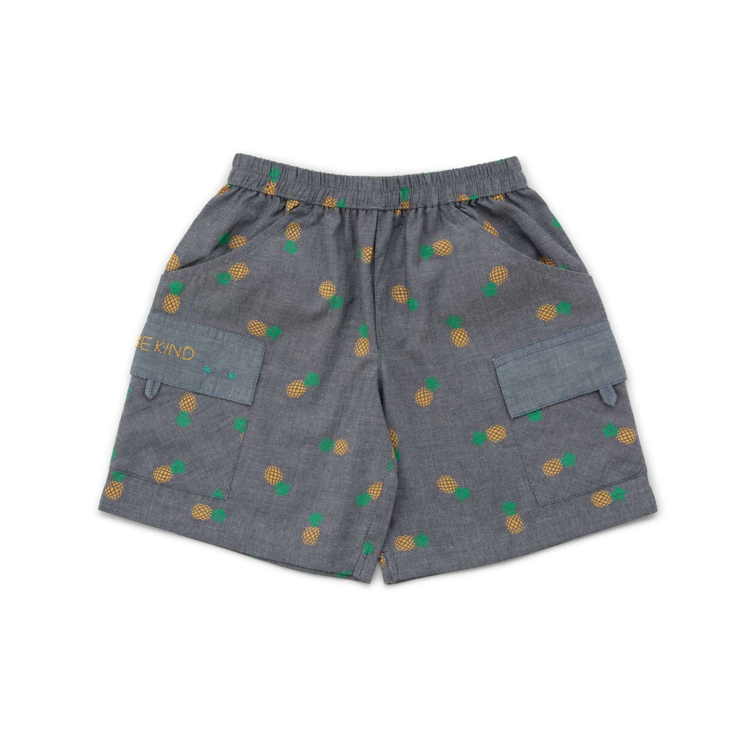 Flatlay of grey shorts with pineapple print and pockets with hand embroidered message