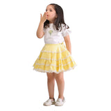 Girl wearing a party outfit with a gathered yellow skirt with lace trims and an ivory blouse with hand embroidered posy of flowers