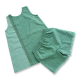 A-line girls jumper with a patchwork of a green print and green gingham and matched ruffle shorts