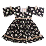Flatlay of girls squareneckline three fourth sleeve Soleilclo dress with lace trims