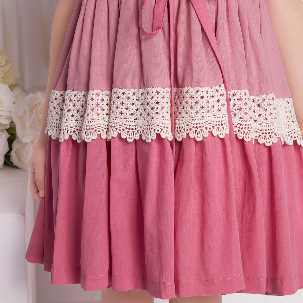 Detailed close-up of the pink ombre embroidered dress skirt