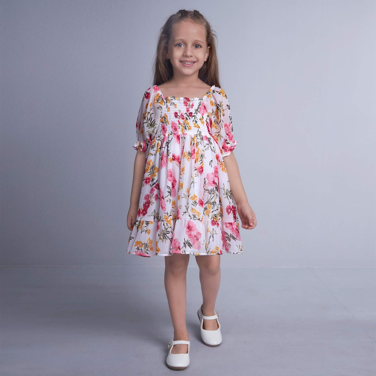 Girl walking wearing white floral chiffon dress