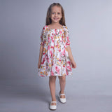 Girl walking wearing white floral chiffon dress