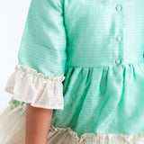 "Close-up details of the green zari checked cotton silk half sleeves dress."