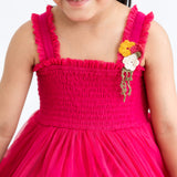 Close-up of a pink hand-embroidered crochet nylon tulle sleeveless dress.