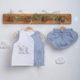 Hand-embroidered jabla with striped bloomer set from Soleilclo, hanging on hangers.