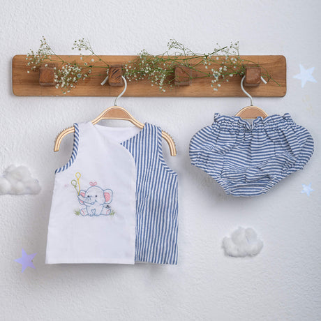 Hand-embroidered jabla with striped bloomer set from Soleilclo, hanging on hangers.