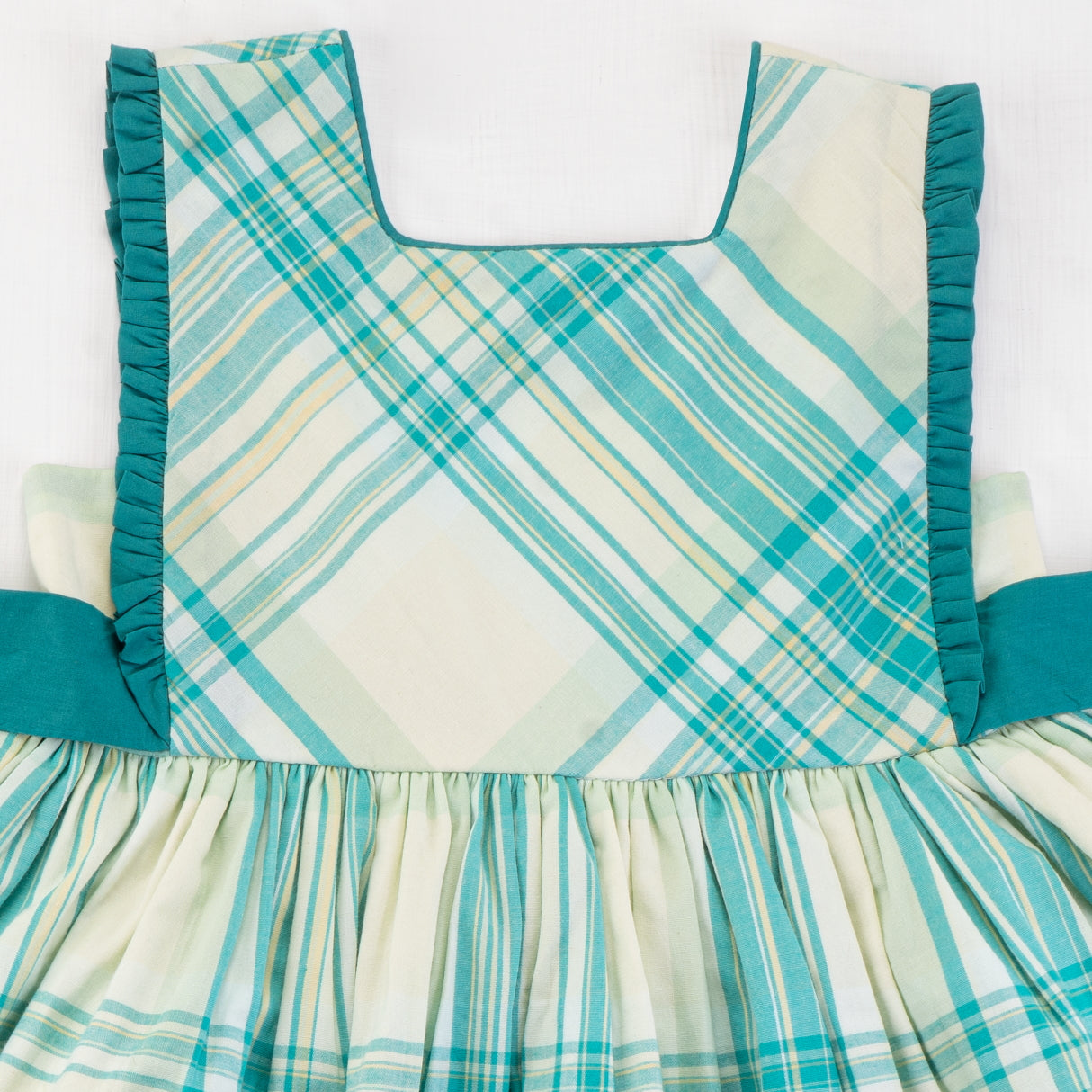 Close-up of the bodice of the green plaid cotton dress