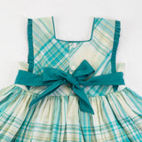 Close-up of the back ties of the green plaid cotton dress