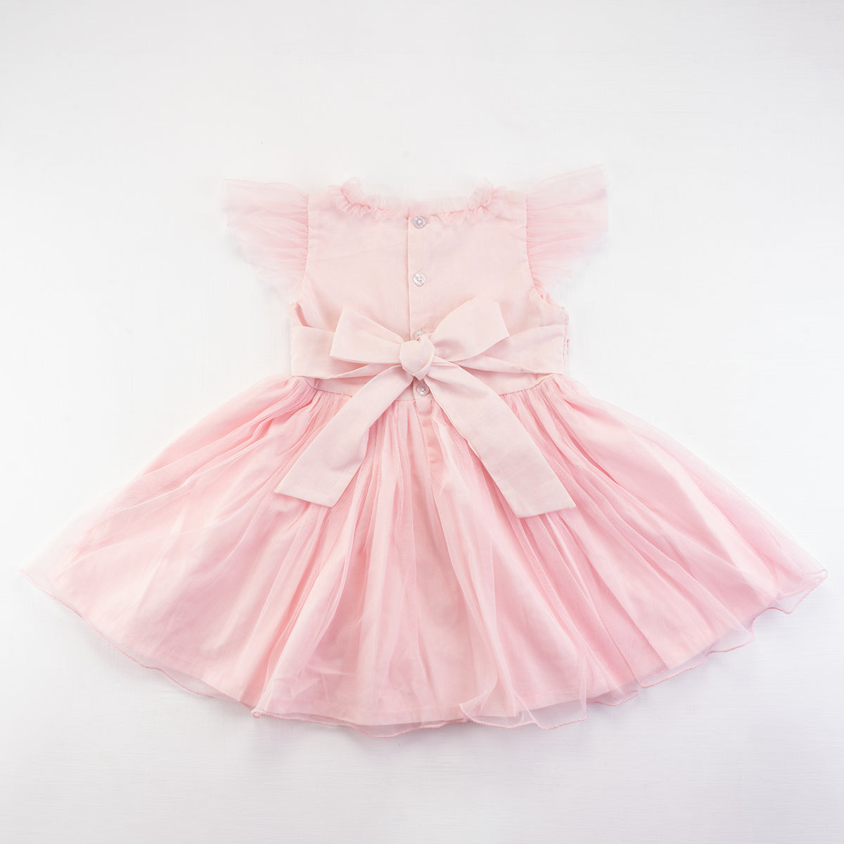 Back view of the pink smocked girls dress