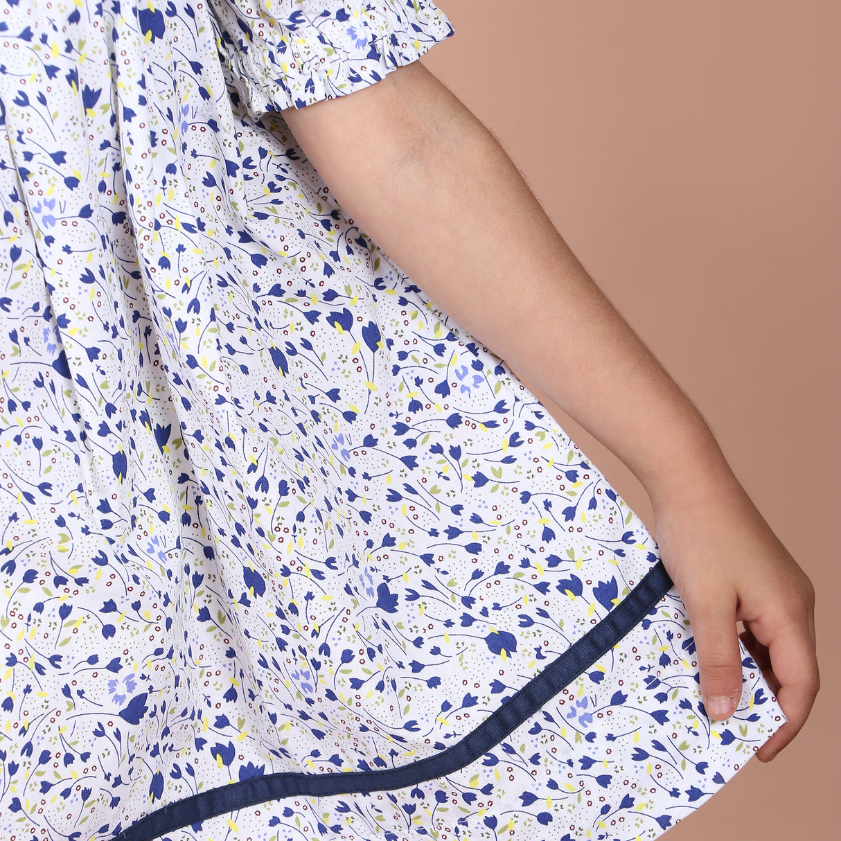 gathered skirt with contrast navy fabric trim along the hem