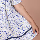 gathered skirt with contrast navy fabric trim along the hem