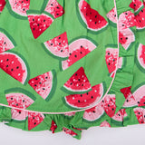 closeup of watermelon print and piping detail on green skort