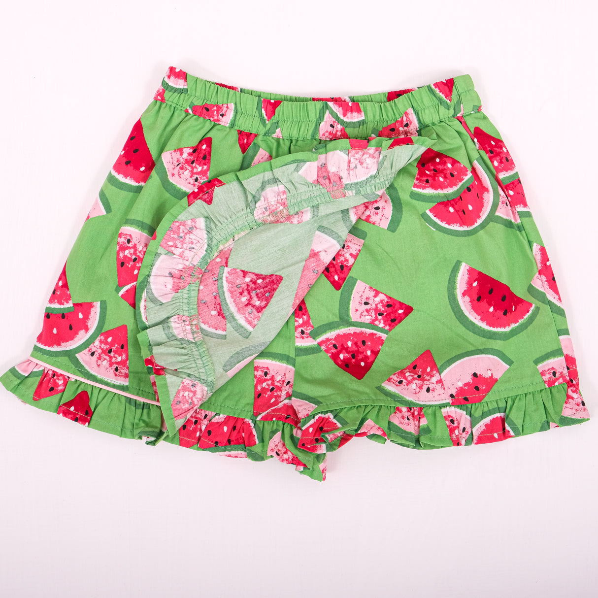 front view showing inner lining and overlap detail of green watermelon skort