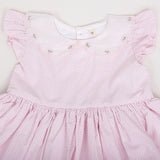 closeup of the embroidery detail in the scallop collar