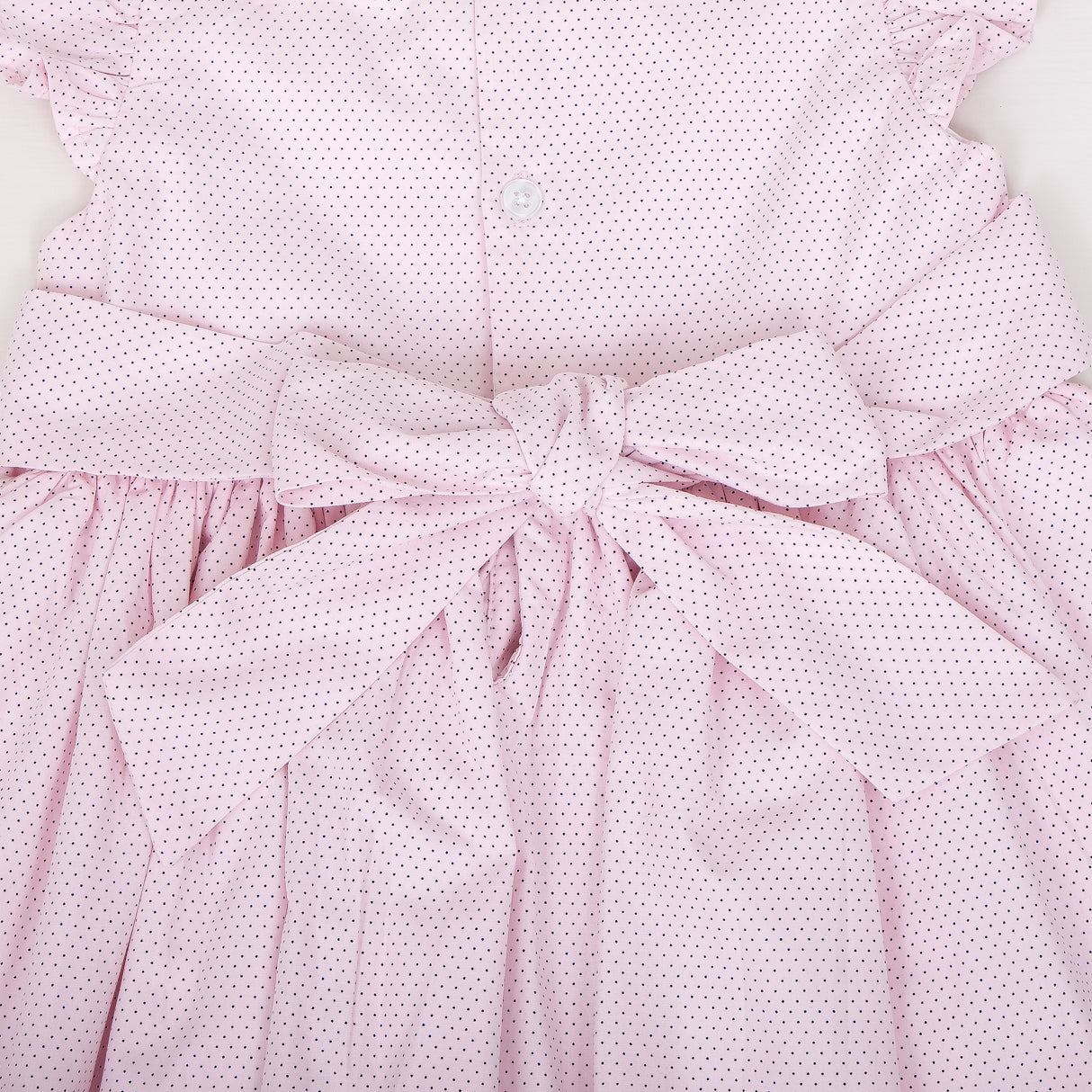 closeup of bow and back button detail