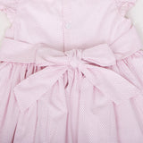 closeup of bow and back button detail