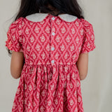 closeup of the back buttons of the red vintage rose print dress