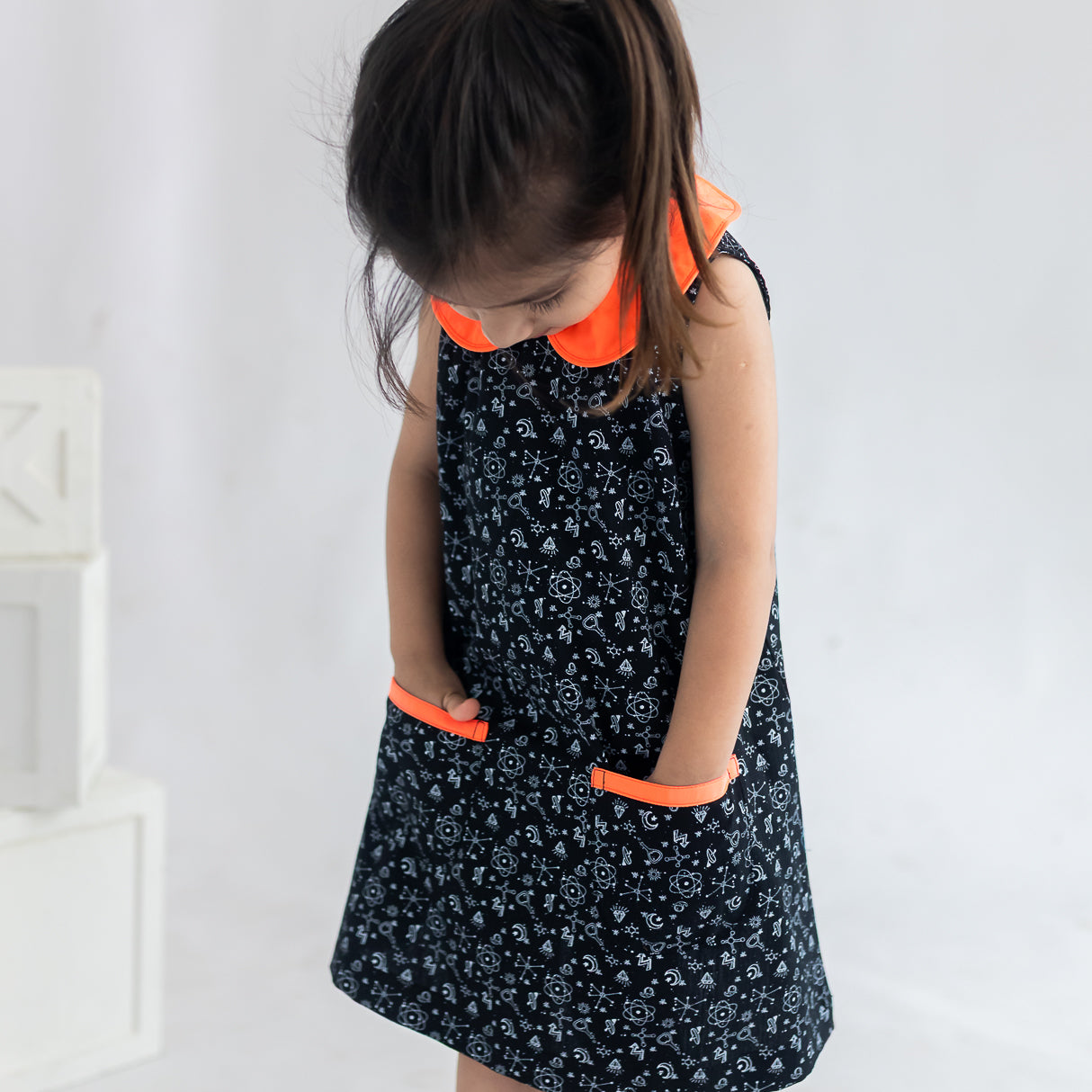 closeup of the pockets of the  black science print a line dress