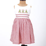 a mannequin in kids red and white striped Christmas tree embroidered dress