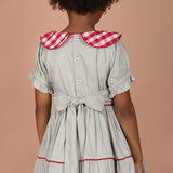 back view of girls dress showing back-button closure