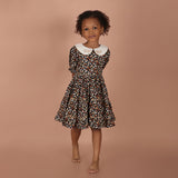 full  view of black floral hand-embroidered layered girls dress